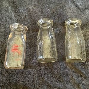 Set of three antique half-pint glass milk bottles